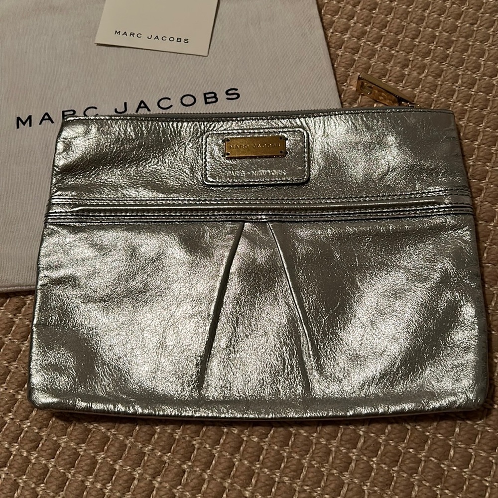 Like NEW - Marc Jacobs silver leather clutch with gold detailing and dust bag.